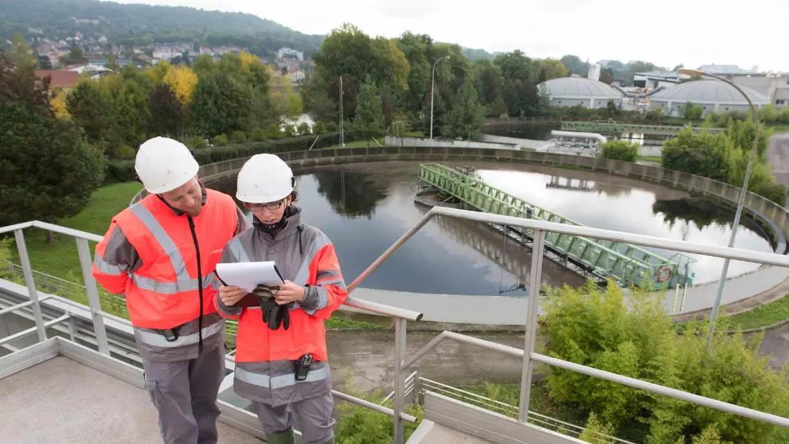 Wastewater treatment facility infrastructure with tanks and piping system for water processing